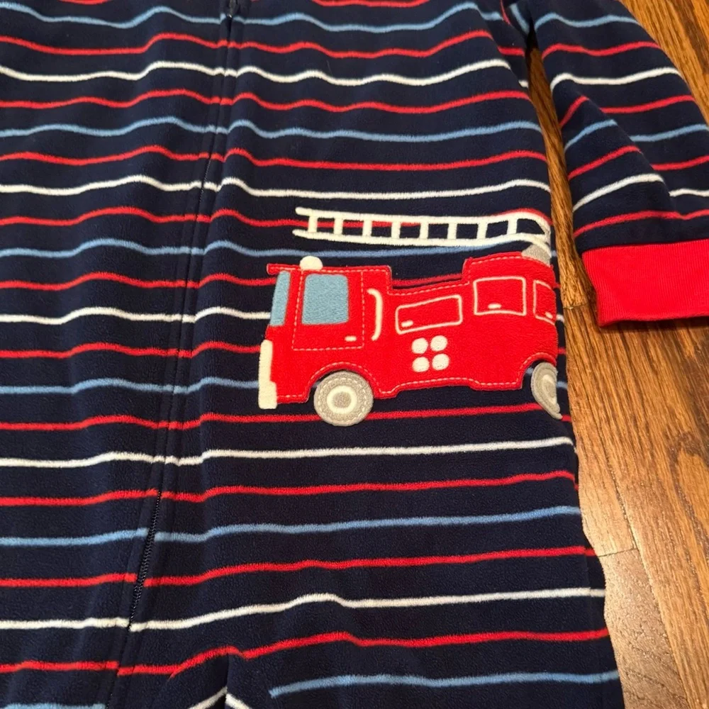 Pair of Carter's fleece PJs with zipper and footies.  Size 24 Months